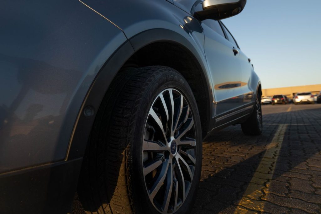 Close-up of a modern car parked in Buenos Aires during sunset, showcasing urban lifestyle.